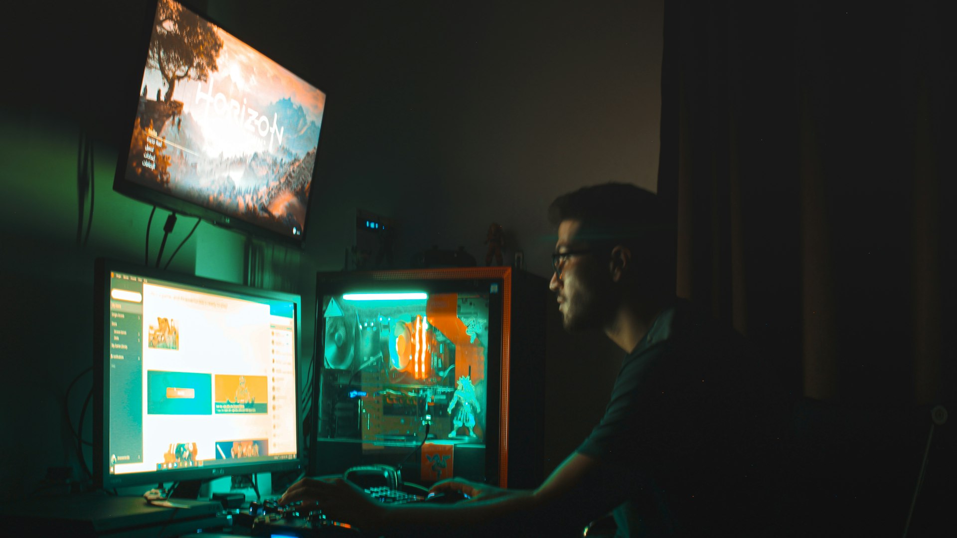 Gaming setup lit in purple neon